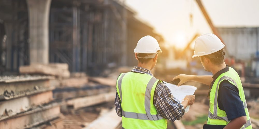 A,Team,Of,Civil,Engineers,And,Architects,Wearing,Safety,Gear